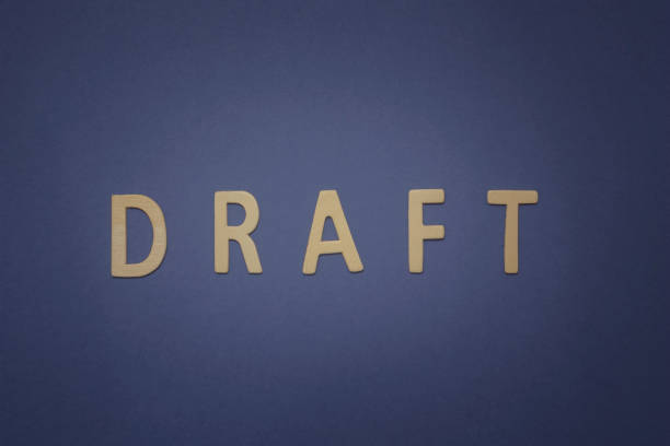 istock Draft written with wooden letters on a blue background 942413676