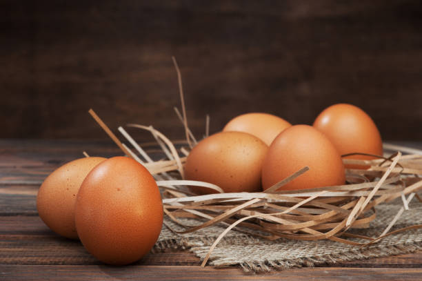 istock chicken eggs on wooden background 942416058