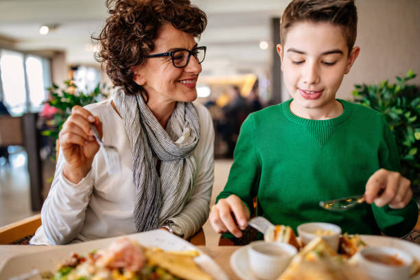 istock Mother with her son in a restaurant 942421514