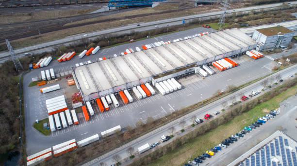 istock Distribution logistics building parking lot - aerial view 942425568