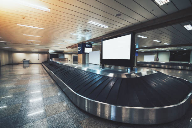 istock Empty baggage conveyor belt in modern airport terminal 942425732