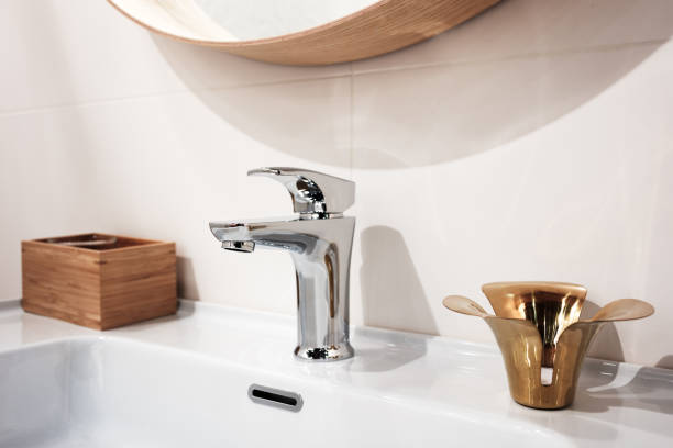 istock Bathroom interior with sink and faucet 942429324