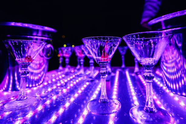 istock empty Martini glasses on table with lights in the restaurant 942429618