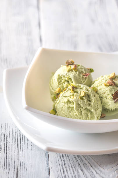istock Pistachio ice cream in the bowl 942432618
