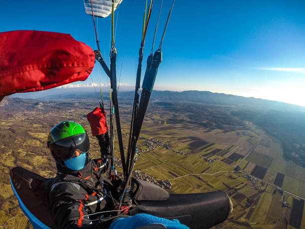 istock Adult Paraglider Taking a Selfie While Gliding 942433556