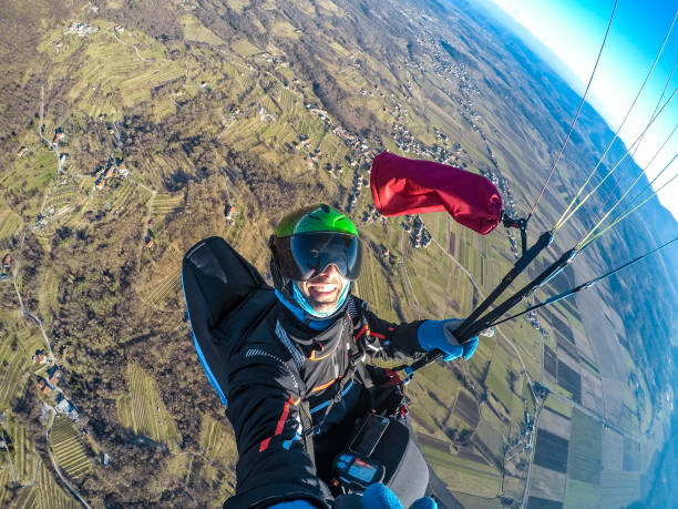 istock Adult Paraglider Taking a Selfie While Gliding 942433570
