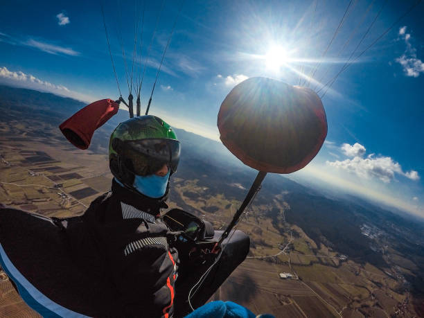 istock Adult Paraglider Taking a Selfie While Gliding 942436050