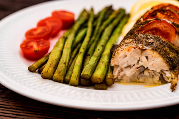 istock Roasted zander fillet with asparagus and lemon 942436774