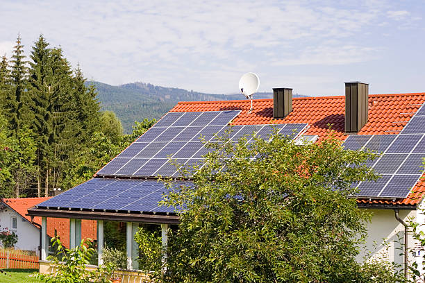 istock House with solar panels on the roof 94243687