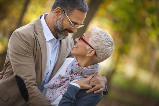 istock Mid aged couple in a park 942437184