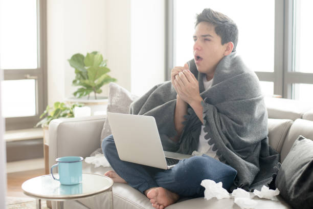 風邪を引く若いヒスパニック男 - coughing illness men latin american and hispanic ethnicity ストックフォトと画像