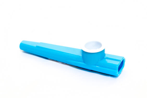 Childrens blue plastic kazoo on a white background stock photo