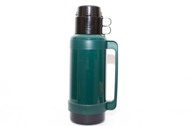 Large green plastic thermos flaskon a white background stock photo