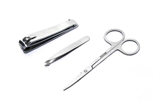istock Grooming kit: nail clippers tweezers scissors  on a white background 942440510