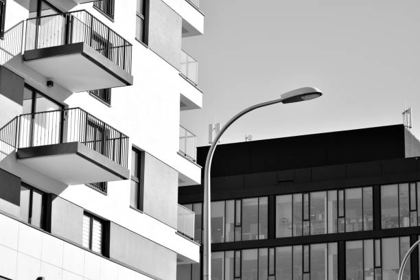 istock Facade of a modern apartment building. Black and white. 942443276
