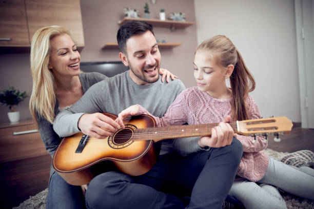 istock Happy young family having fun at home 942448166