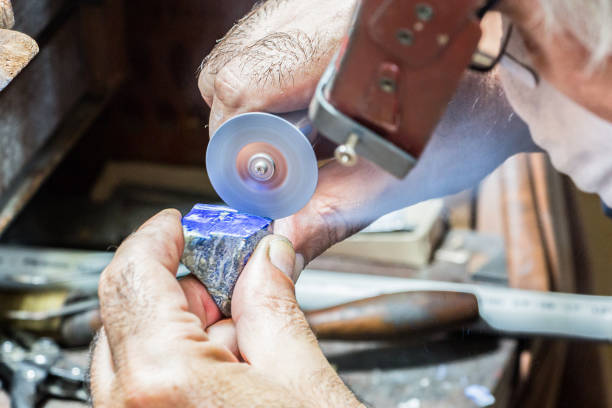 istock Jeweler engraving diamonds on a ring. 942455830