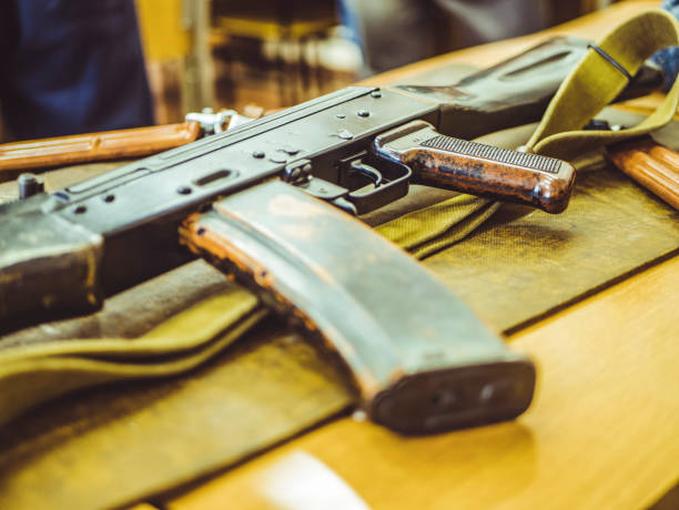 istock close up assault weapon rifle on the table auto shootgun 942456200