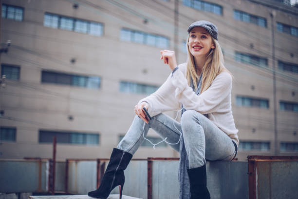istock Woman listening music on mobile 942456590