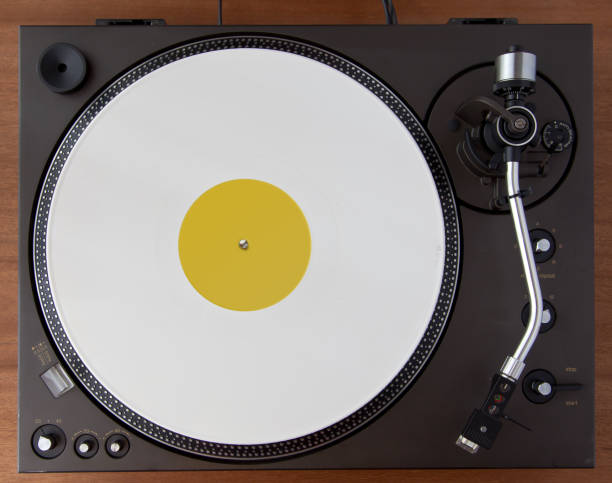 istock Vintage Record Turntable Player With White Vinyl Disk 942456638