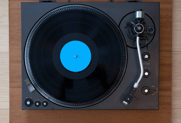 istock Vintage Record Turntable Player with Black Vinyl Disk 942458764