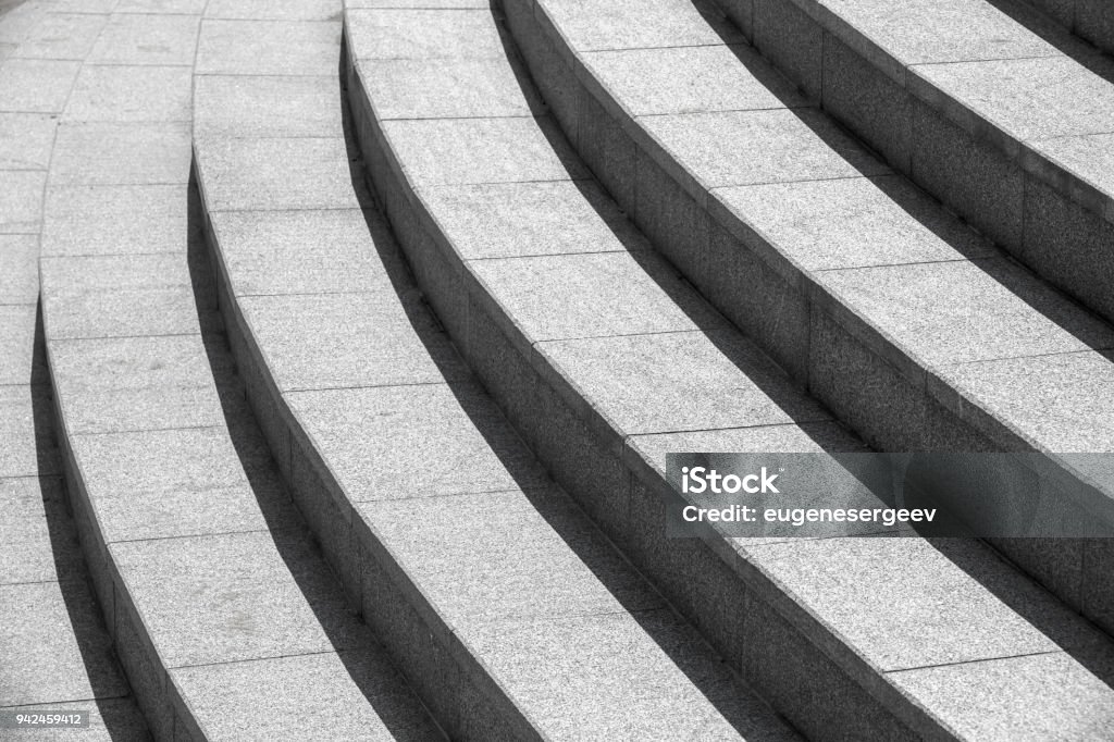 Architecture background, dark round stairs Abstract architecture background, dark gray round stairs Staircase Stock Photo