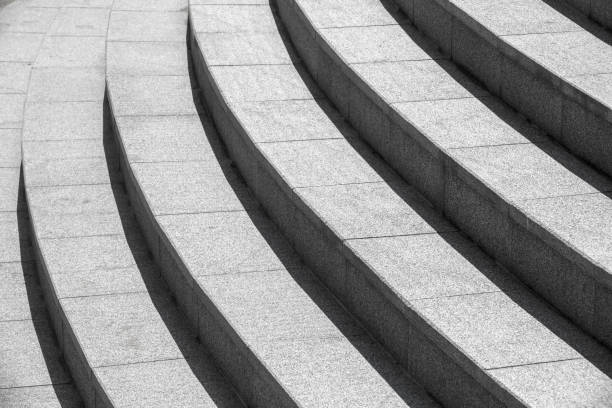 Architecture background, dark round stairs Abstract architecture background, dark gray round stairs outdoor staircase stock pictures, royalty-free photos & images