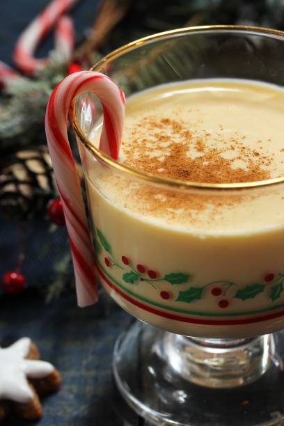 istock Eggnog - Xmas Holiday drink on festive blue background 942466172
