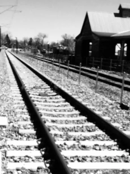 Black and white image of railroad tracks.