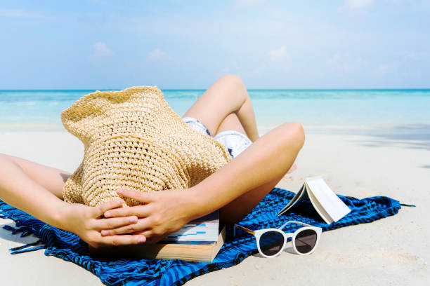 istock Asian women relaxing in summer holiday on beach 942466838
