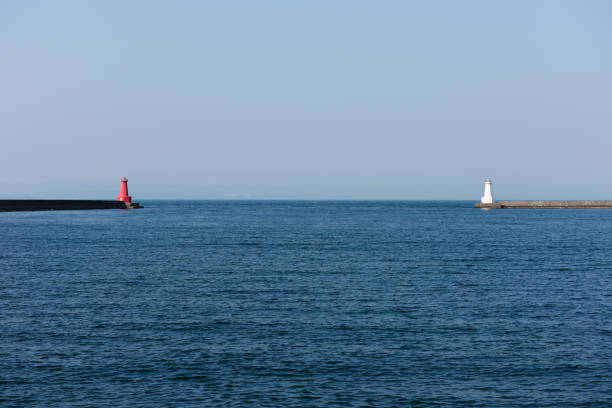 istock View of harbor and lighthouse. 942469220