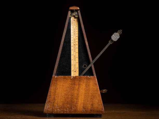 detail of an old mechanic musical metronome - allegro imagens e fotografias de stock