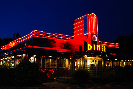 Hyde Park, NY, USA September 4, 2009: A classic American diner's neon lights glow in twilight in Hyde Park, New York