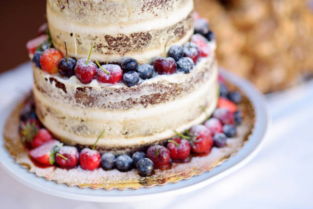 istock Delicious chocolate wedding cake decorated with fruits and berries 942476462