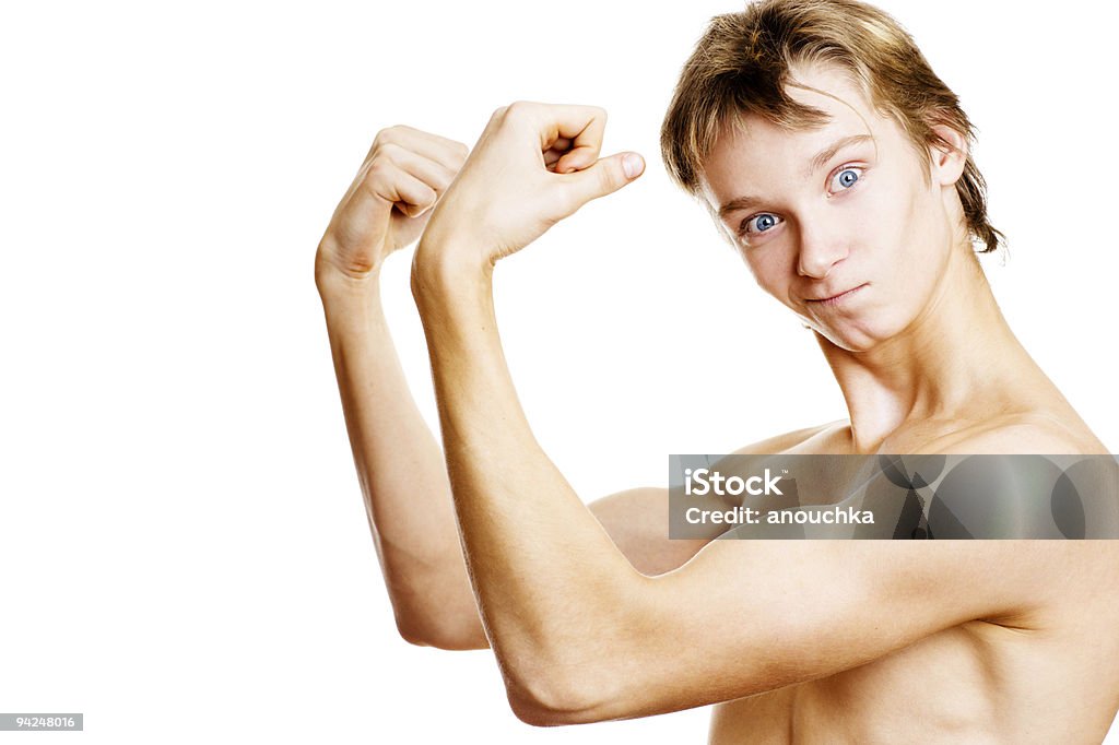 Teenager menino mostrando os músculos - Foto de stock de Fazer Careta royalty-free