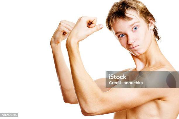 Foto de Teenager Menino Mostrando Os Músculos e mais fotos de stock de Fazer Careta - Fazer Careta, Perfil - Vista Lateral, Retrato