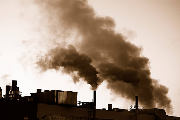 Factories during industrial revolution producing pollution stock photo