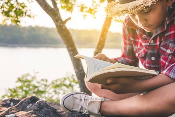 istock Men tourists education read books in quiet nature. 942498280
