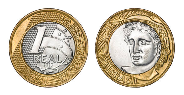 istock One brazilian real coin, front and back faces 942498312