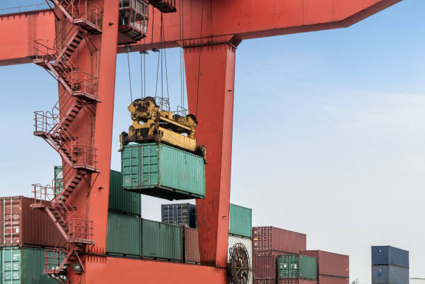 istock The crane is hoisting containers at the wharf 942506398