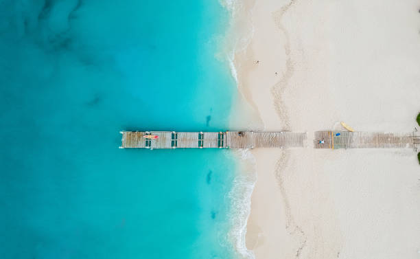 Drone panorama of pier in beach in Grace Bay, Providenciales, Turks and Caicos Drone panorama of pier in beach in Grace Bay, Providenciales, Turks and Caicos. bahamas photos stock pictures, royalty-free photos & images