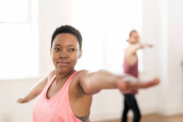 istock Woman and man doing stretching exercise 942510130