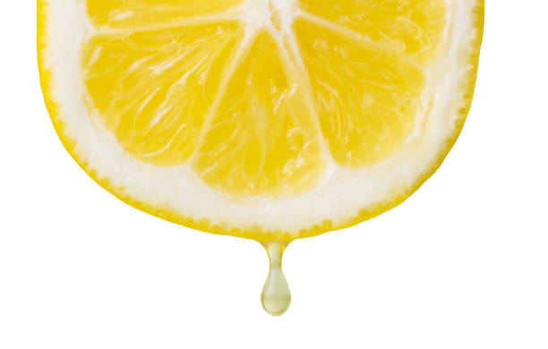 istock Cross section of lemon isolated on white. Closeup 942514592