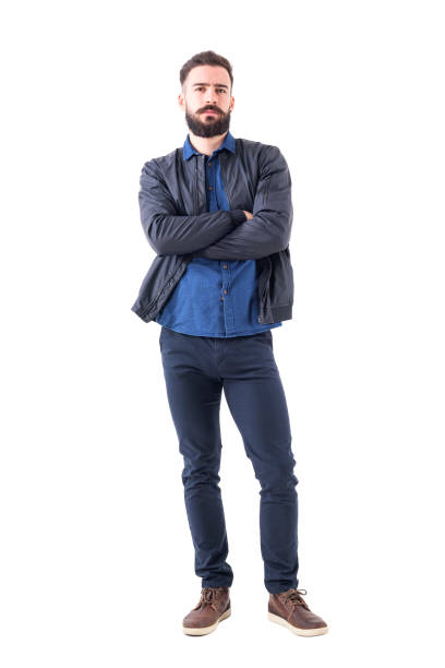 istock Skeptical suspicious uncertain bearded man with folded hands looking at camera. 942518596