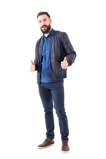 istock Happy smiling relaxed bearded guy showing thumbs up gesture and looking at camera. 942518928