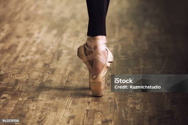 Feet Of Ballerina In Training Shoes On The Parquet Wooden Floor Close Up Retro Style Stock Photo - Download Image Now
