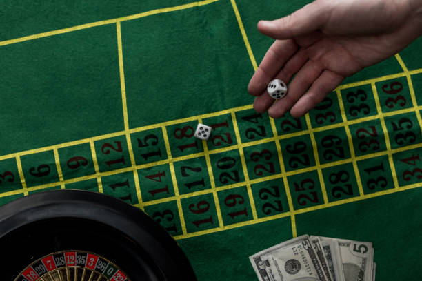 top view of man gambling on roulette at casino, gambling addiction concept top view of man gambling on roulette at casino, gambling addiction concept best golf free bet stock pictures, royalty-free photos & images