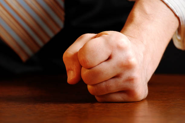 istock Man hitting desk with clenched fist 942519734