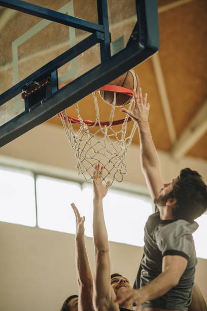 istock Slam dunk on basketball match! 942522578