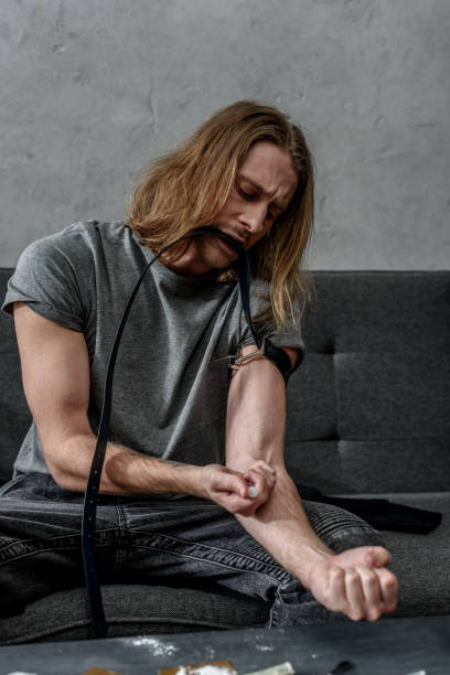 istock young addicted junkie doing heroin injection 942525574